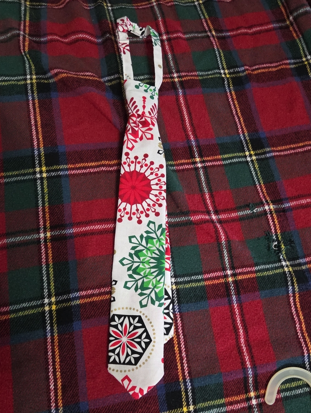 Kids Holiday Print Necktie in White with Red and Green Snowflake Motifs
